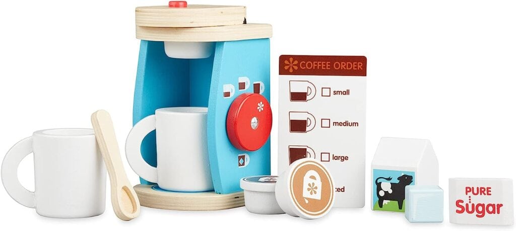A Melissa & Doug Brew and Serve Wooden Coffee Maker Set with cups and sugar.