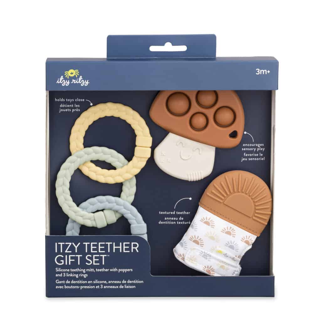 An Itzy Ritzy Teething Baby Gift Set with a toother, teether, and a pacifier.