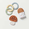 An Itzy Ritzy Teething Baby Gift Set, a ring, and a mushroom.