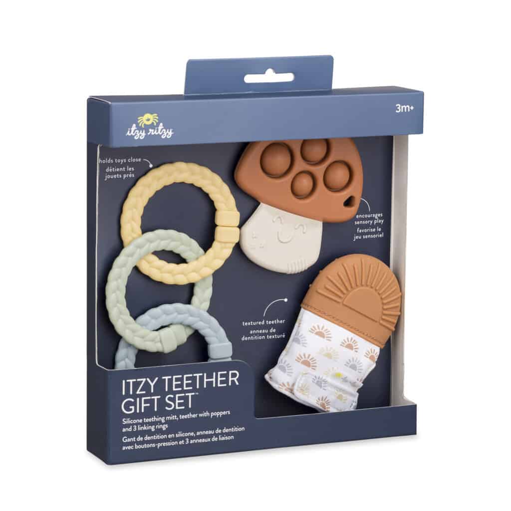 A Itzy Ritzy Teething Baby Gift Set with a toothbrush and a tooth brush.