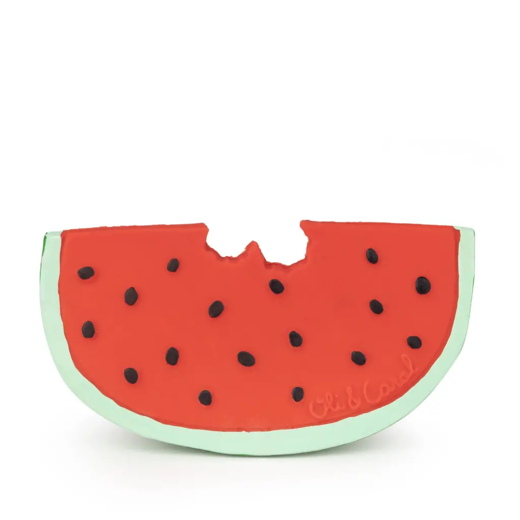 A Oli & Carol Wally the Watermelon Baby Teether Natural Rubber with a bite taken out of it.