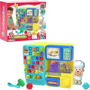 Introducing the CoComelon Learning Kitchen 34 Piece Interactive Play Kitchen—a vibrant set featuring letters, numbers, fun sounds, a pretend stove, cooking utensils, plastic food items, and a smiling chef figure. The packaging displays a child joyfully playing with the toddler toy kitchen set.