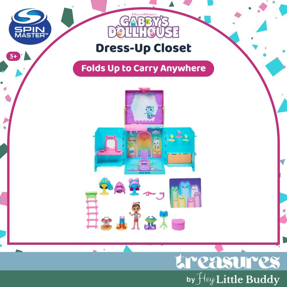 gabbydollhouse-dressupcloset-56 Gabby’s Dollhouse Dress-Up Closet Portable Playset is shown open, featuring mini figures, accessories, and a vibrant wardrobe displayed in front. Text highlights that it folds up for easy carrying.