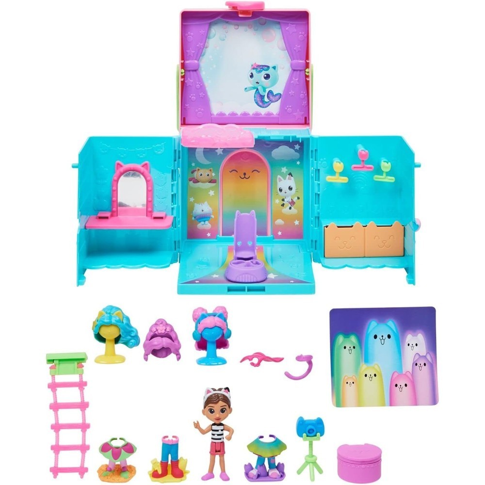 gabbydollhouse-dressupcloset-58 Gabby’s Dollhouse Dress-Up Closet Portable Playset is a colorful toy set featuring a fold-out case with themed scenery, small surprise accessories, and a Gabby doll, all arranged neatly on a white background.