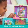 gabbydollhouse-dressupcloset-61 A child plays with the Gabby’s Dollhouse Dress-Up Closet Portable Playset, holding a blue accessory near the Gabby doll on stage. The text at the bottom reads, “Time for a Photo Shoot.”.
