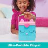 gabbydollhouse-dressupcloset-62 A smiling child in a pink shirt holds the Gabby’s Dollhouse Dress-Up Closet Portable Playset, featuring a cat-themed handle. The text at the bottom reads “Ultra-Portable Playset.”.