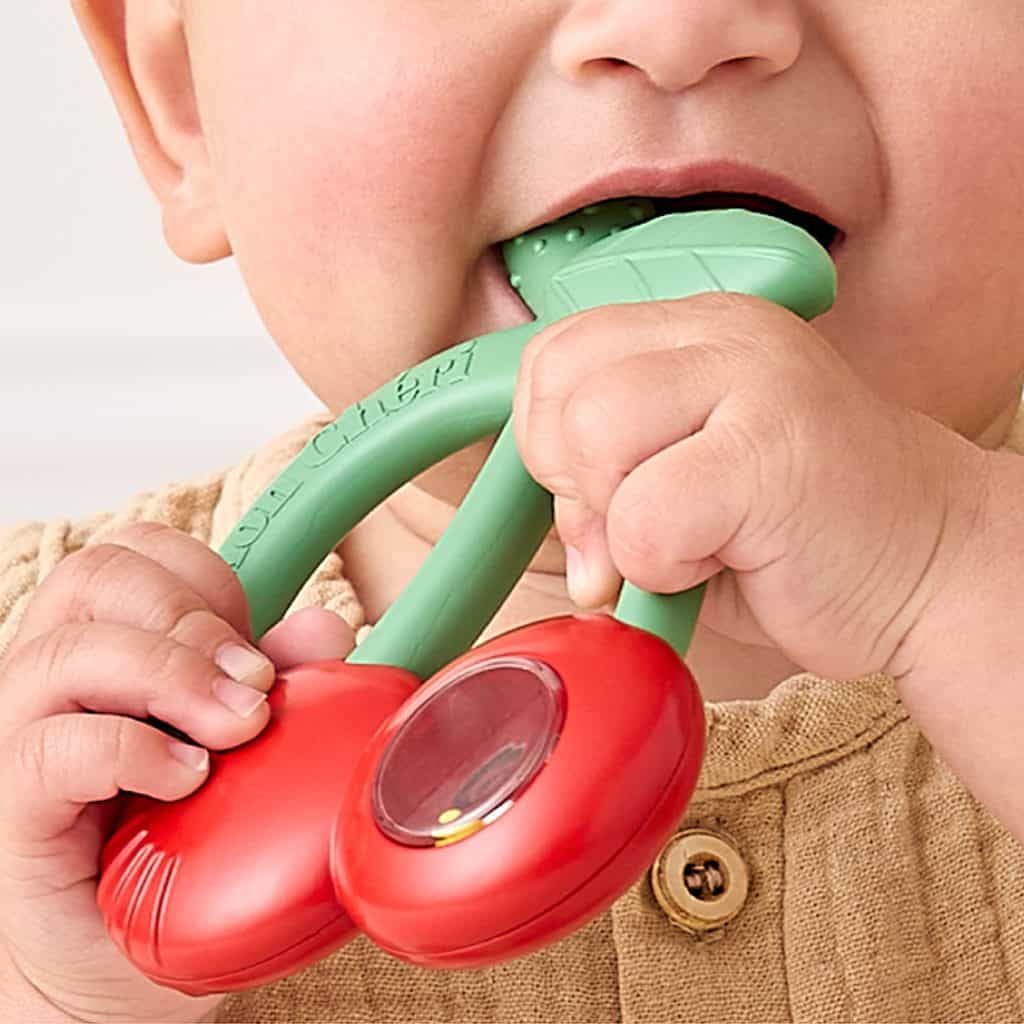 Itzy Ritzy Bitzy Shake silicone teether with rattle in the Cherries design Itzy Ritzy Bitzy Shake silicone teether with rattle in the Cherries design