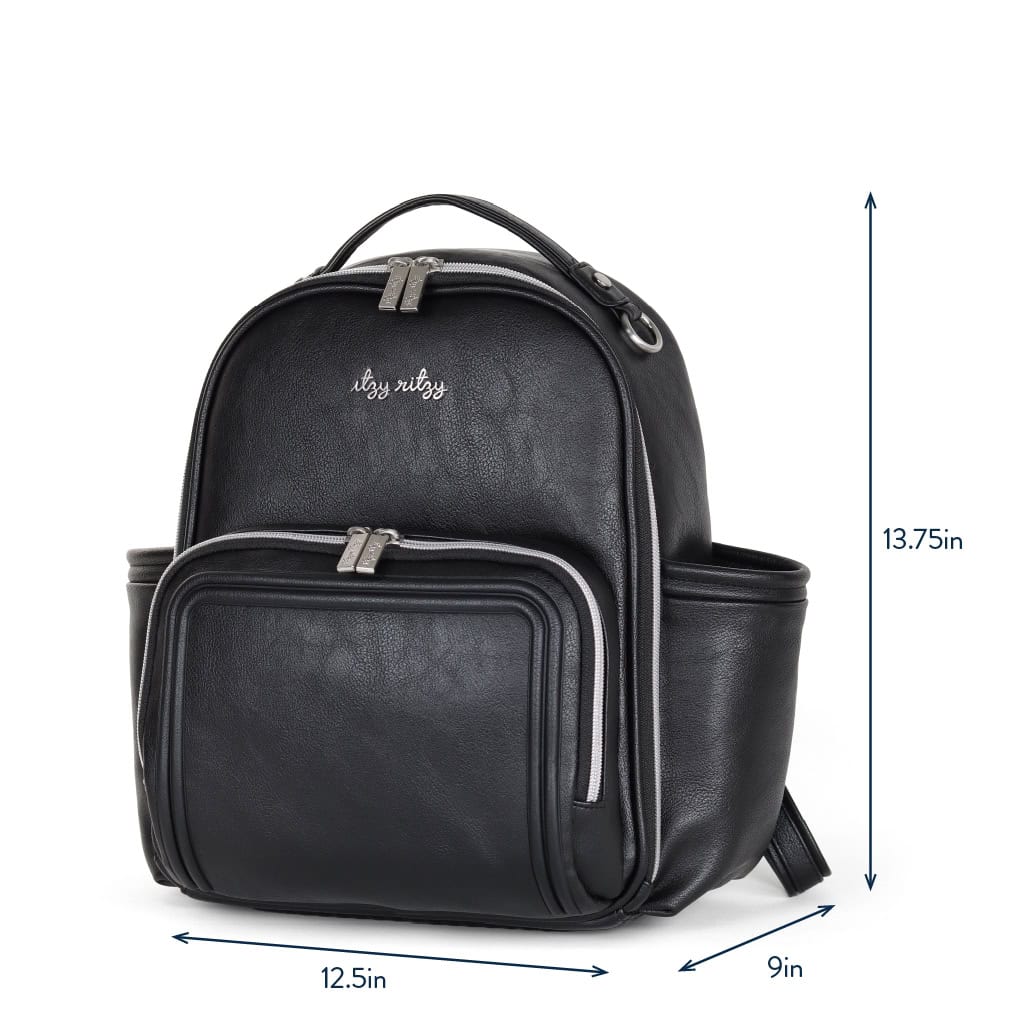 itzy-ritzy-101401619-itzy-mini-plus-backpack-noir-1 A black leather-look backpack with various compartments, silver zippers, and measurements listed as 13.75 inches tall, 9 inches wide, and 12.5 inches long.