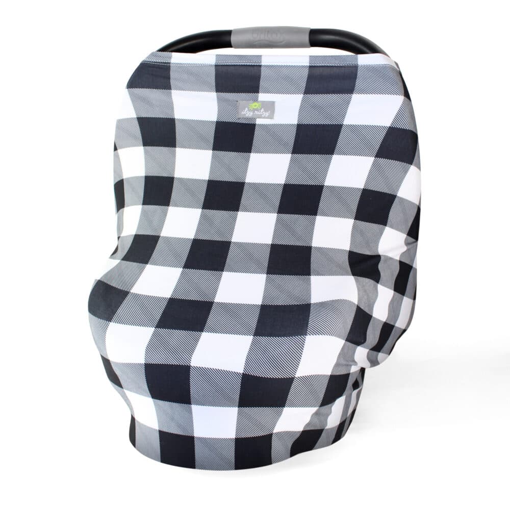 A black and white plaid Mom Boss™ 4-IN-1 Multi-Use Nursing Cover & Scarf car seat cover.