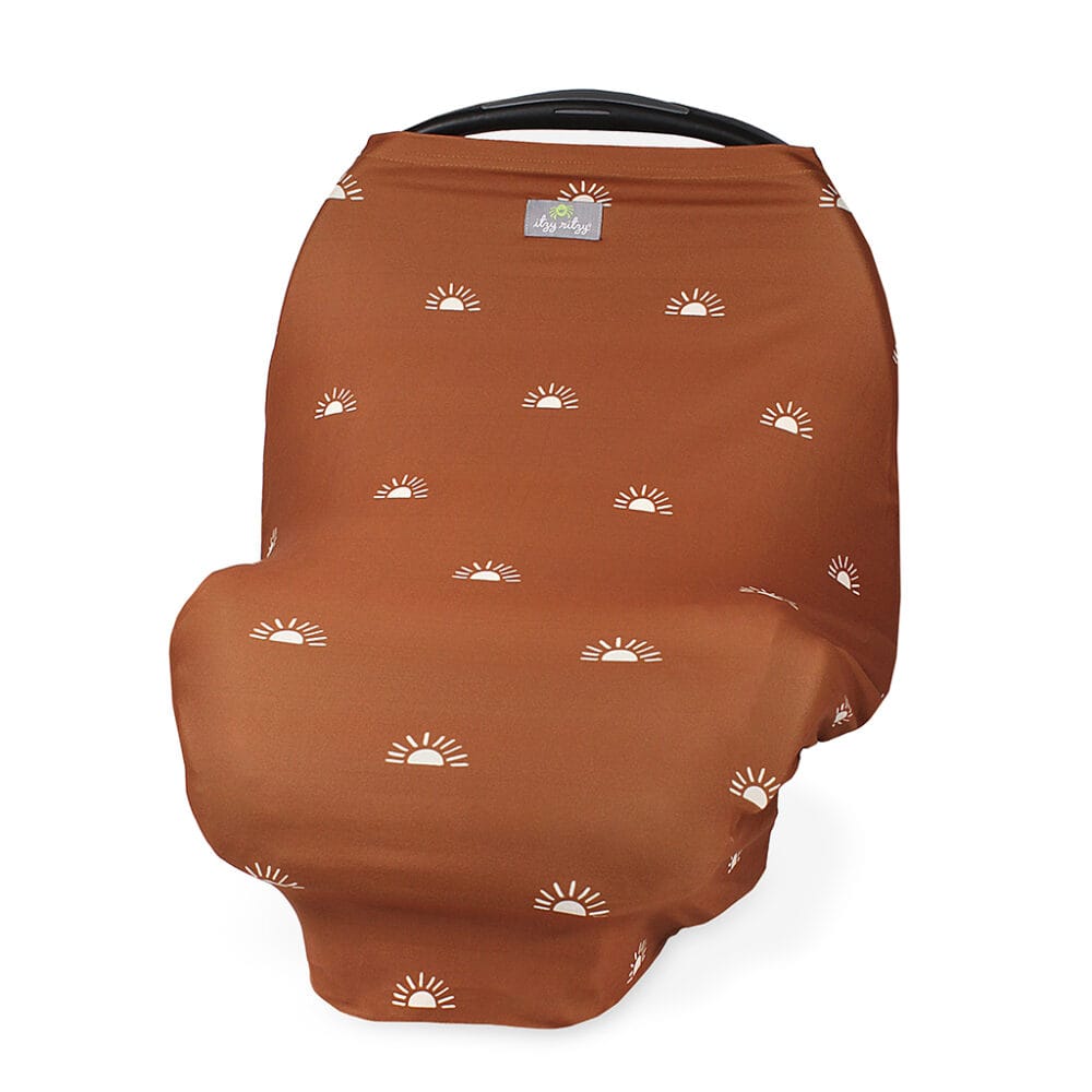 A brown Mom Boss™ 4-IN-1 Multi-Use Nursing Cover & Scarf with white suns on it.