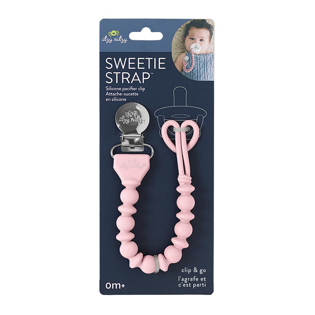 Package of a pink silicone pacifier clip labeled "Sweetie Strap" by Itzy Ritzy, shown with an image of a baby using it. Suitable for newborns and older. Pins with "clip & go" text at the bottom.