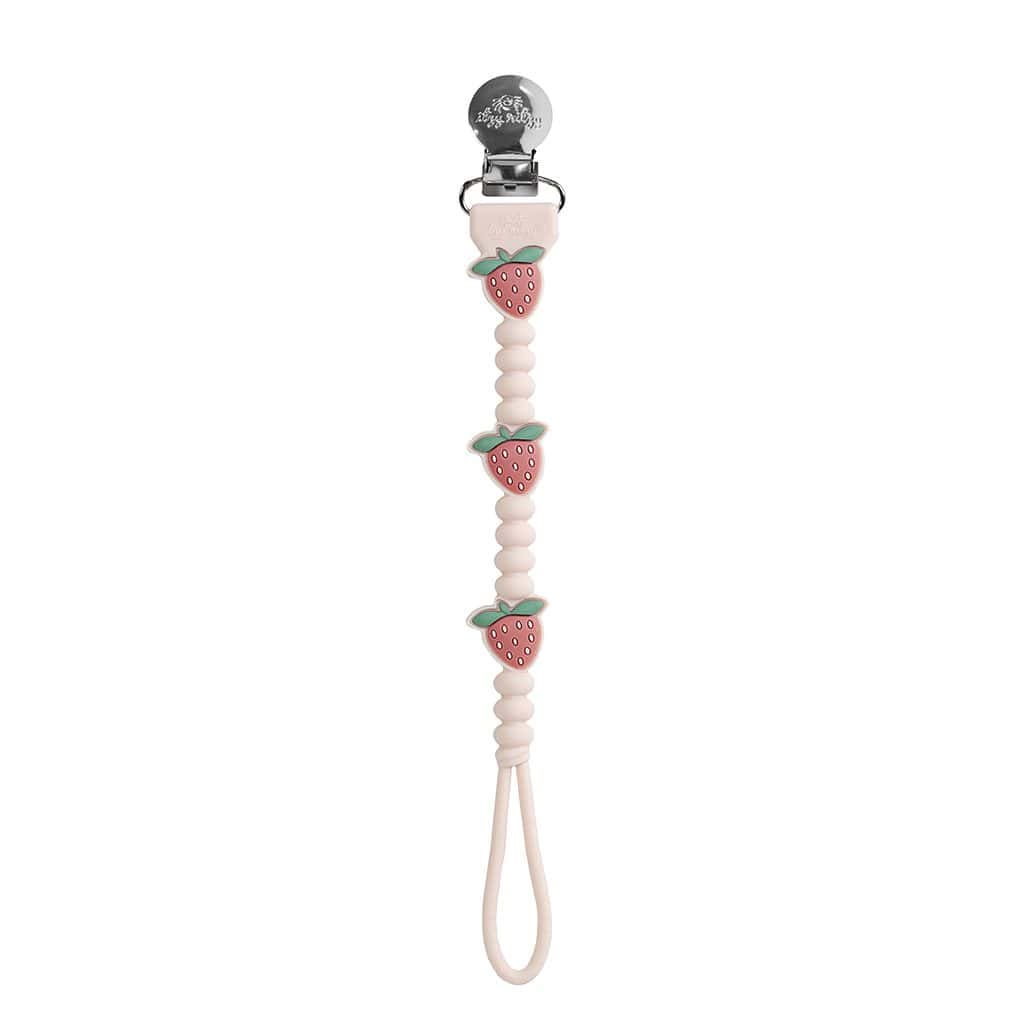 itzy-strap-plus-strawberry-01 A beaded pacifier clip with three strawberry-shaped decorations, a metal clip at one end, and a loop at the other end.
