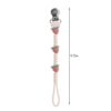 itzy-strap-plus-strawberry-04 A 9.75-inch pacifier clip with three strawberry designs, a metal clasp at the top, and a loop at the bottom.