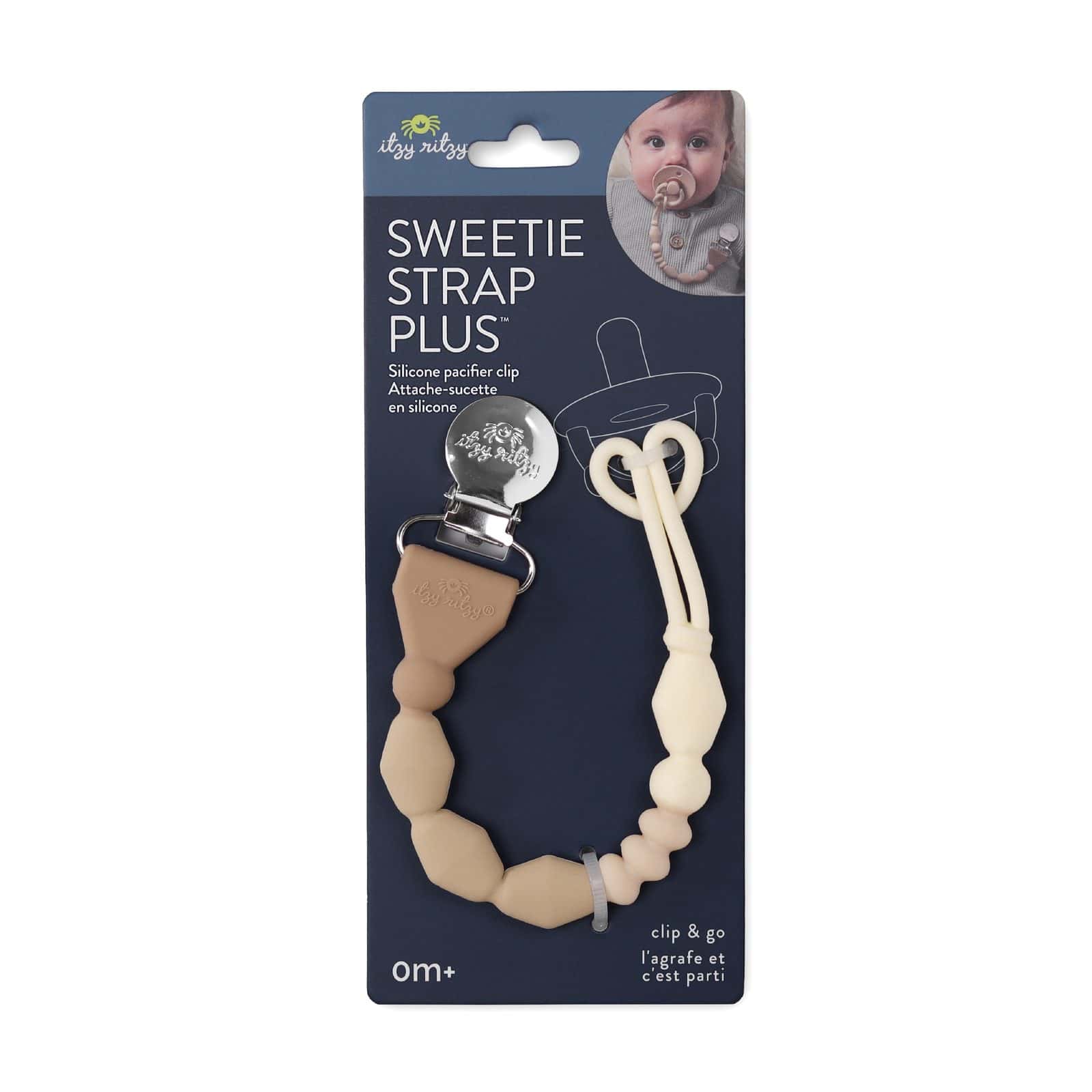 itzy-strap-plus-toast-02 A silicone pacifier clip called “Sweetie Strap Plus” by Itzy Ritzy is shown in beige tones, attached to retail packaging with a baby photo and product information.