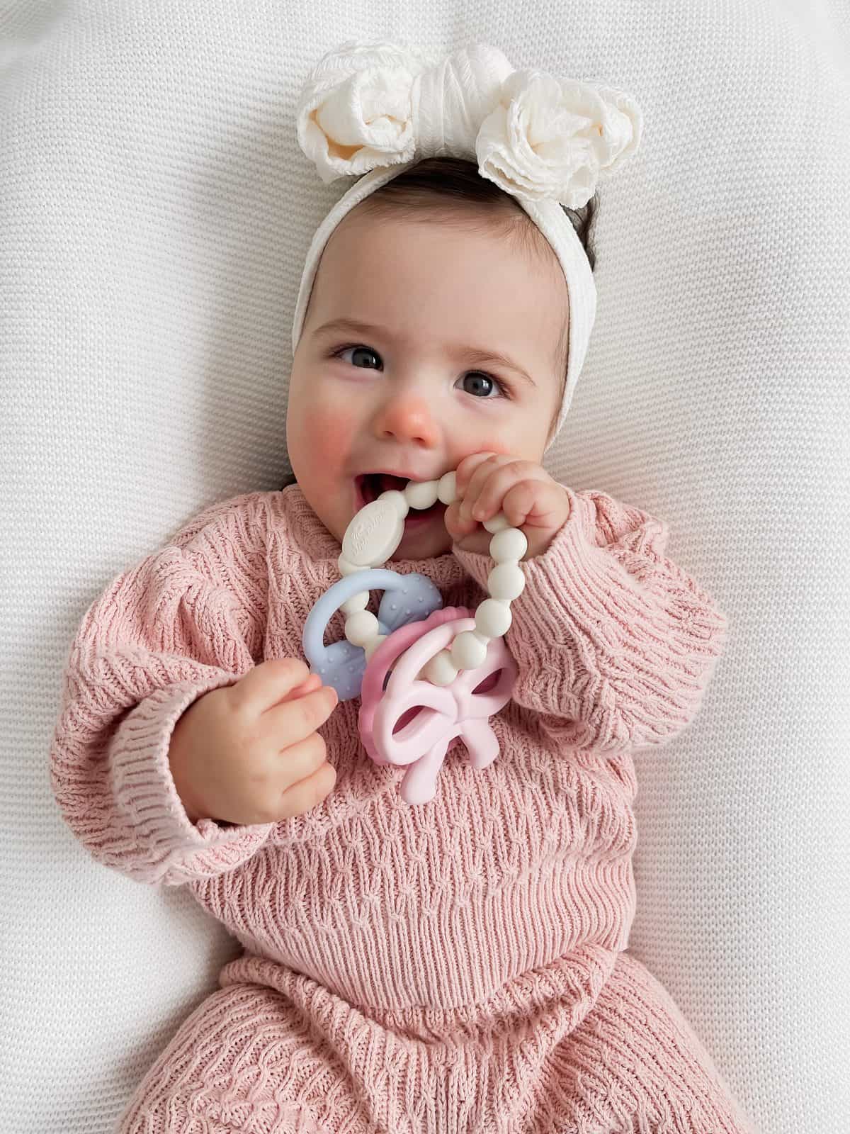 Itzy Ritzy Itzy Trio silicone teether Bows Itzy Ritzy Itzy Trio multi textured silicone teether in the Bows style