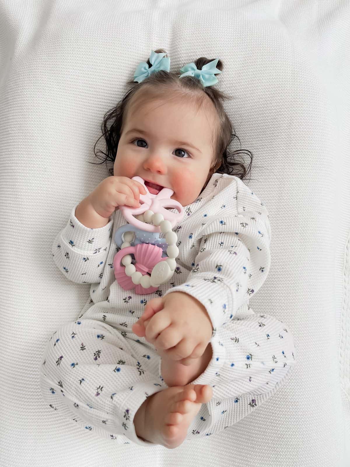 Itzy Ritzy Itzy Trio silicone teether Bows Itzy Ritzy Itzy Trio multi textured silicone teether in the Bows style