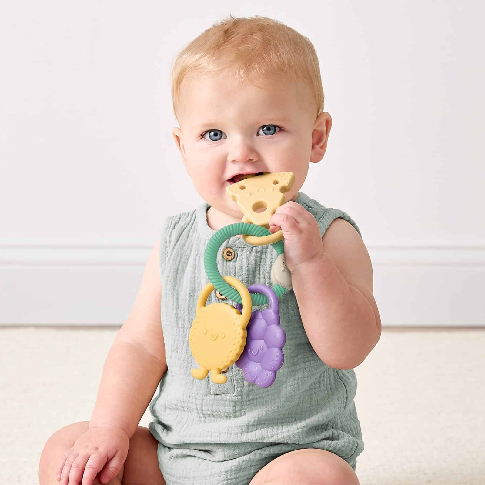Itzy Ritzy Itzy Trio silicone teether Charcuterie Itzy Ritzy Itzy Trio multi textured silicone teether in the Charcuterie style