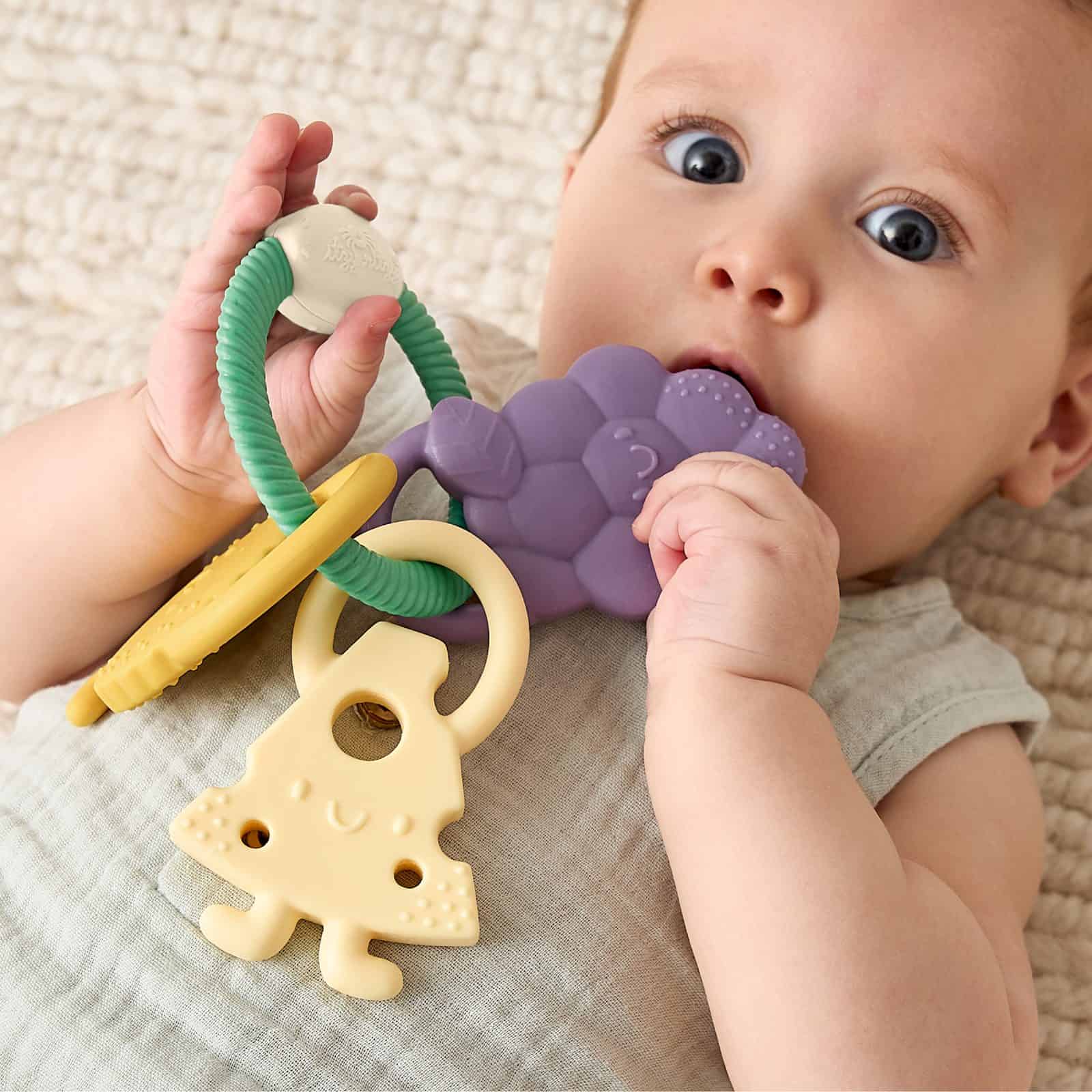 Itzy Ritzy Itzy Trio silicone teether Charcuterie Itzy Ritzy Itzy Trio multi textured silicone teether in the Charcuterie style