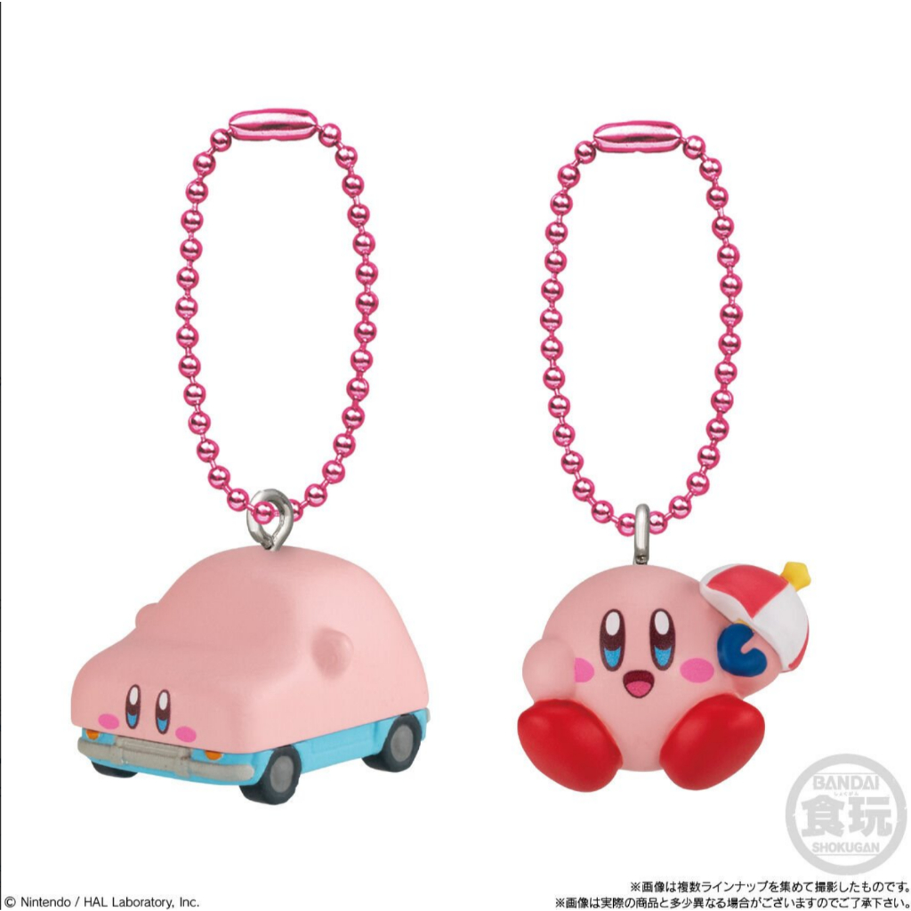 kirby-shokugan-5 Two Kirby Mascot Shokugan Wave 1 Box Keychain Collection keychains: one features Kirby as a pink car, and the other shows Kirby sitting while holding a red-and-white parasol. Both come with pink beaded keychain loops.