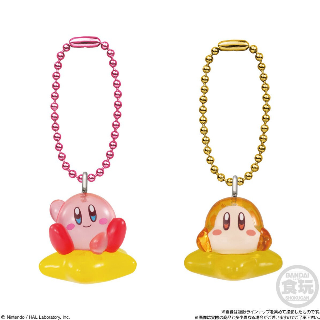 kirby-shokugan-6 Two Kirby Mascot Shokugan Wave 1 Box Keychain Collection keychains—one featuring Kirby and the other Waddle Dee sitting atop yellow stars—are shown attached to colored beaded chains against a white background.