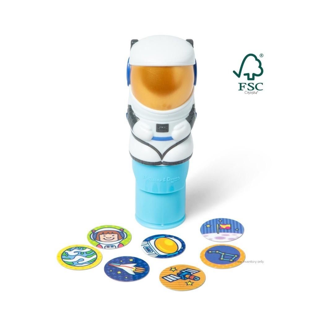 melissadoug-stickerwow-8 A Melissa & Doug Sticker WOW Activity Pad features a toy astronaut figure standing upright with seven colorful space-themed stickers arranged in a semicircle in front of it.