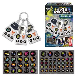The Bandai Splatoon 3 Gear Triple Custom Charm Acrylic Keychain Blind Box Shokugan includes a set of three acrylic keychain charms and a box, displayed alongside sheets of circular icons featuring various in-game symbols and gear abilities.