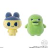tamagotchi-frienddoll-4 Featuring two Bandai Tamagotchi Otomodachi Friend Doll Flocked Figures—Mametchi, a yellow character with blue ears and a cap, and Kuchipatchi, a green figure with round eyes and a wide mouth—both displayed against a white background.