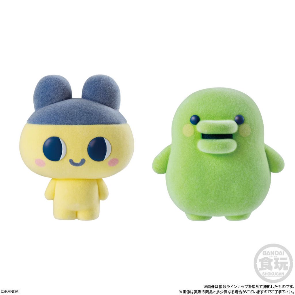 tamagotchi-frienddoll-4 Featuring two Bandai Tamagotchi Otomodachi Friend Doll Flocked Figures—Mametchi, a yellow character with blue ears and a cap, and Kuchipatchi, a green figure with round eyes and a wide mouth—both displayed against a white background.