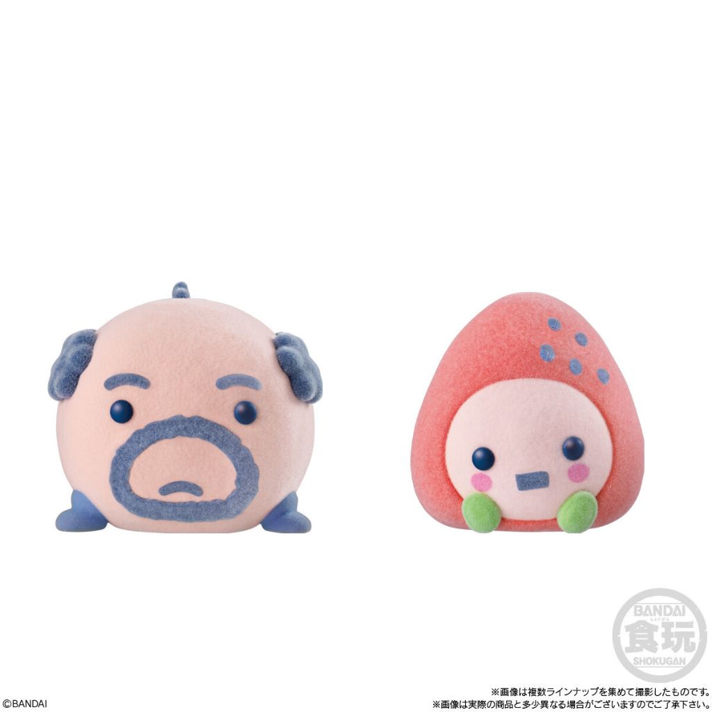 tamagotchi-frienddoll-6 Two Bandai Tamagotchi Otomodachi Friend Doll Flocked Figures: one featuring Mametchi with a bald head, mustache, and blue eyebrows, the other resembling a pink strawberry character with a face and green base.