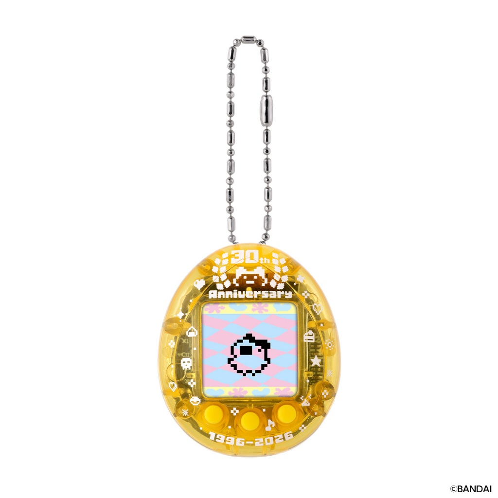 tamagotchi-nanocolorful-mametchimemories-125 A Bandai Tamagotchi Nano Colorful Mametchi Memories 30th Anniversary Yellow Blue Vpet Virtual Pet with a chain, featuring a pixelated pet on its screen and displaying “30th Anniversary” and “1996-2026” on the device.
